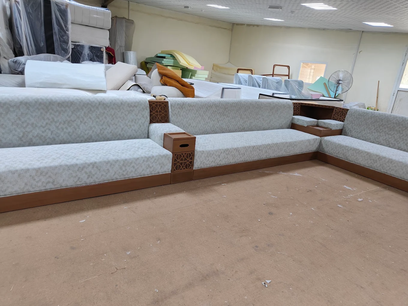 Traditional majlis floor seating with inlaid wood side tables